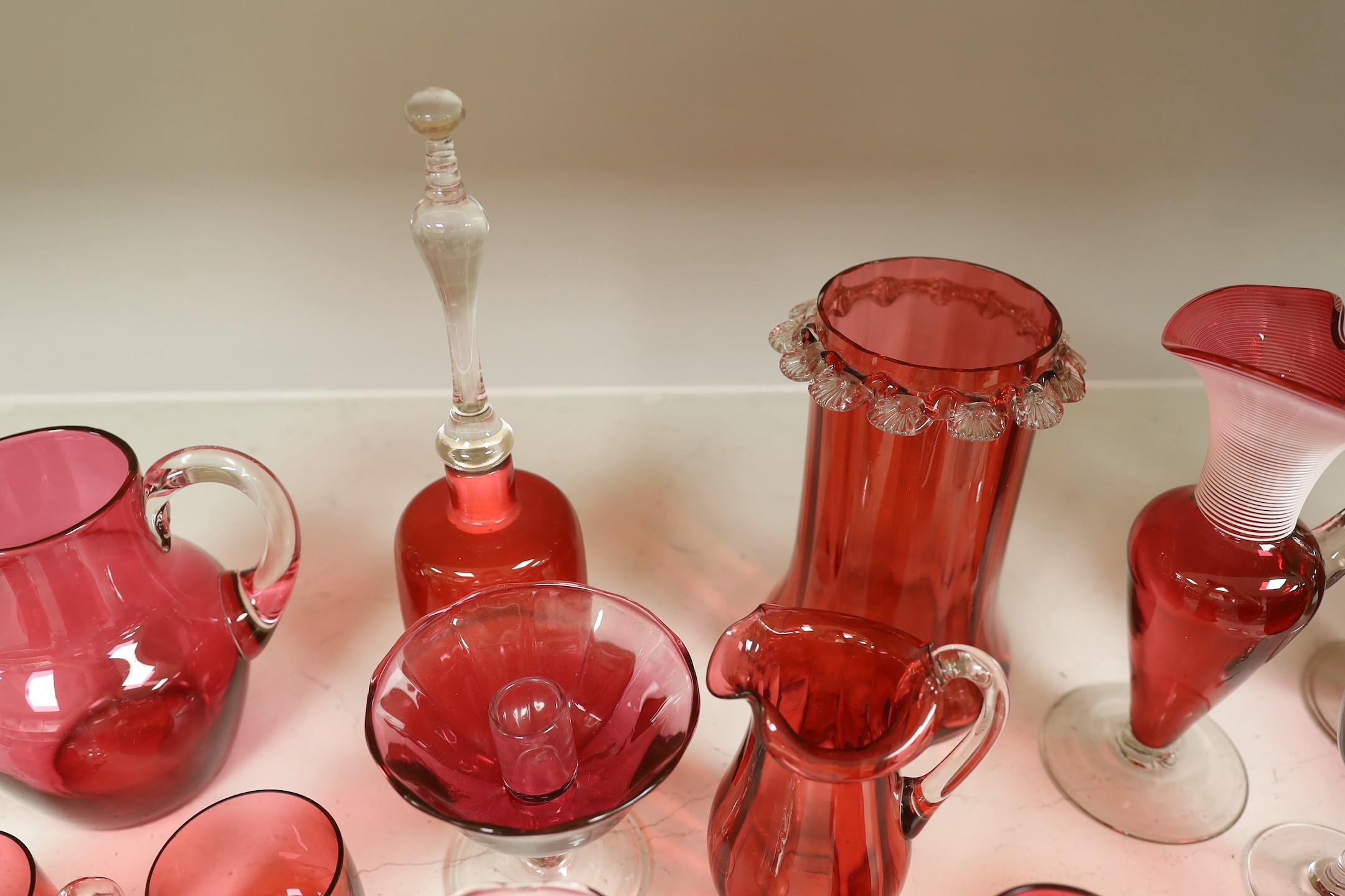 A quantity of various late 19th/early 20th century cranberry glass
